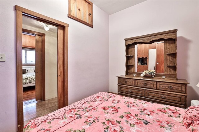 bedroom with light hardwood / wood-style floors