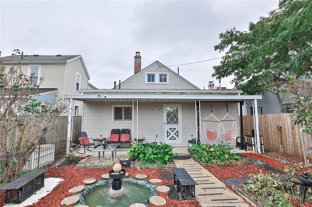 rear view of property with a patio area