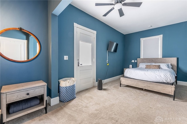 bedroom with light carpet and ceiling fan