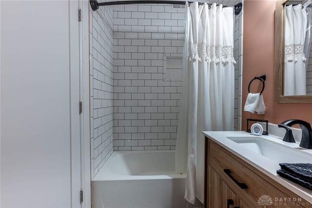 bathroom featuring vanity and shower / bath combination with curtain