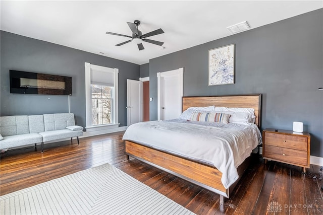 bedroom featuring dark wood-type flooring and ceiling fan