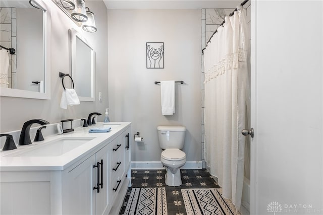 bathroom featuring vanity, a shower with shower curtain, and toilet