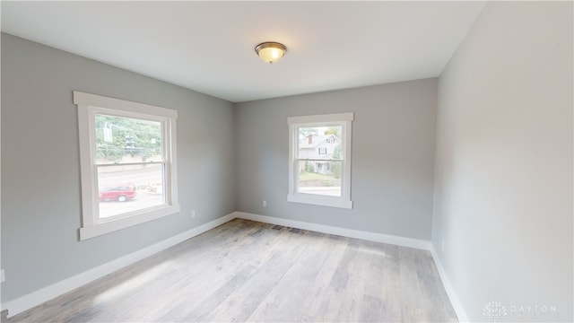 empty room with light wood-type flooring