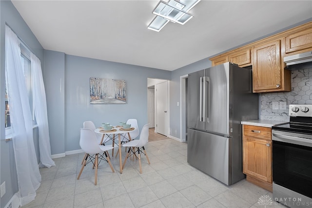 kitchen with tasteful backsplash and stainless steel appliances