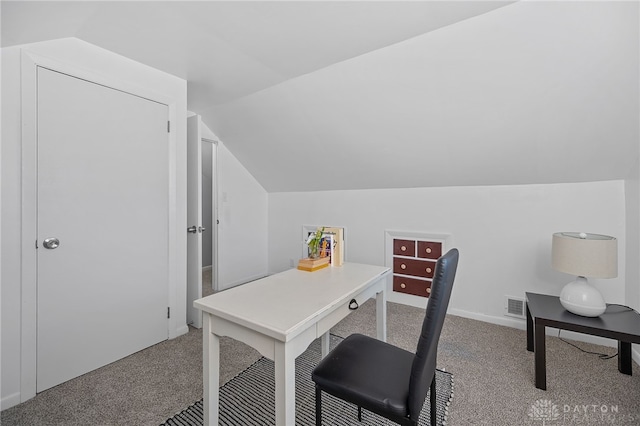 office space with lofted ceiling and carpet