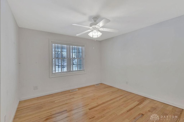 unfurnished room featuring ceiling fan and light wood-type flooring