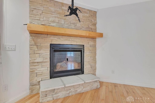 room details featuring hardwood / wood-style floors and a fireplace