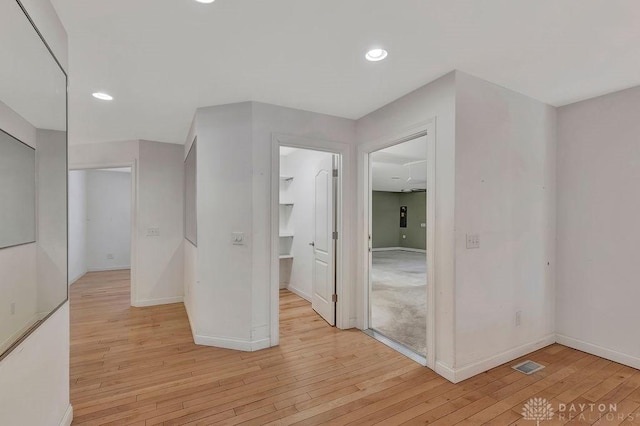 corridor featuring light hardwood / wood-style floors