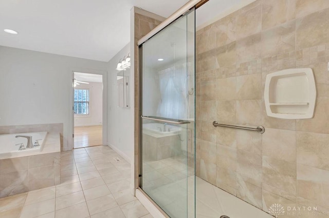 bathroom featuring tile patterned flooring, shower with separate bathtub, and ceiling fan