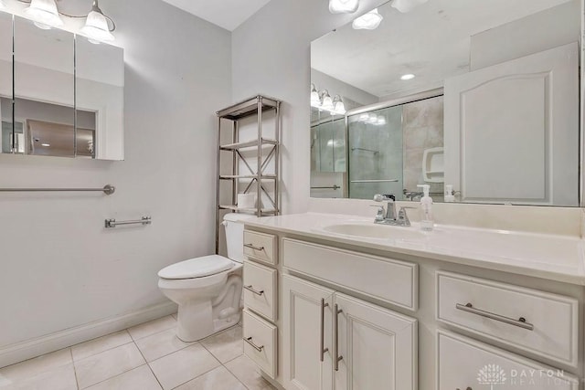 bathroom featuring an enclosed shower, vanity, tile patterned floors, and toilet