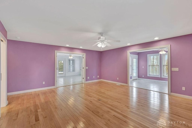 interior space with ceiling fan, plenty of natural light, and light wood-type flooring