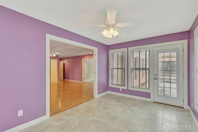 unfurnished room featuring ceiling fan