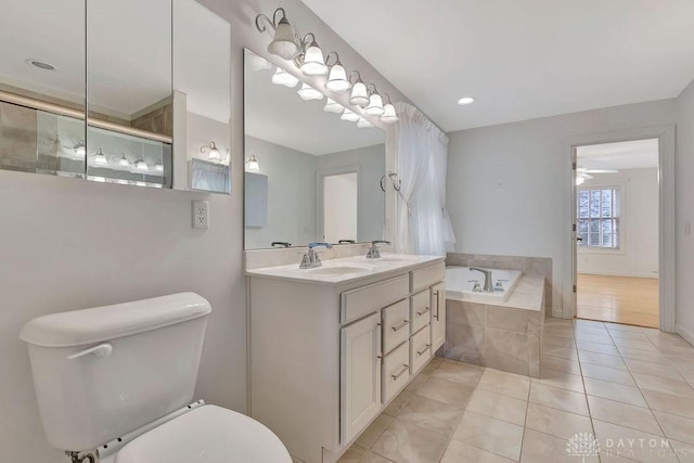 bathroom featuring ceiling fan, tile patterned floors, plus walk in shower, and vanity