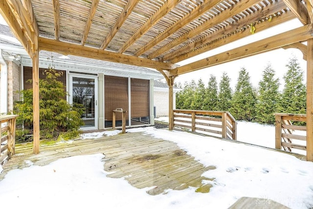 snow covered deck with a pergola