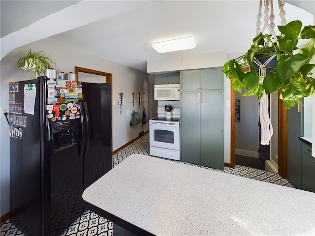 kitchen featuring white appliances and gray cabinets