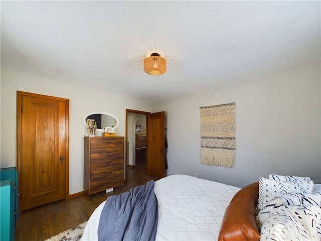 bedroom featuring dark hardwood / wood-style flooring