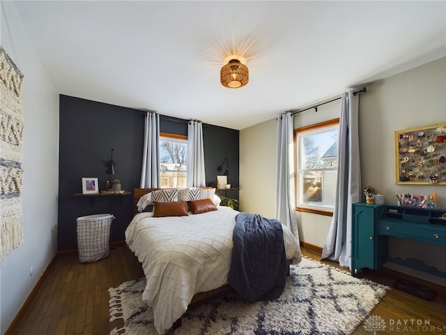 bedroom featuring dark wood-type flooring