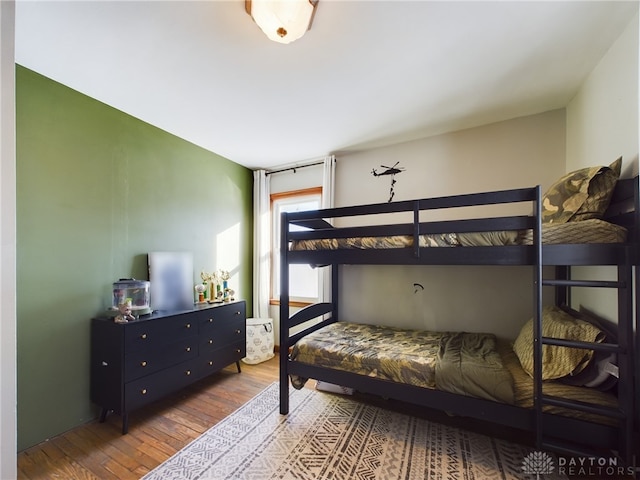 bedroom featuring wood-type flooring