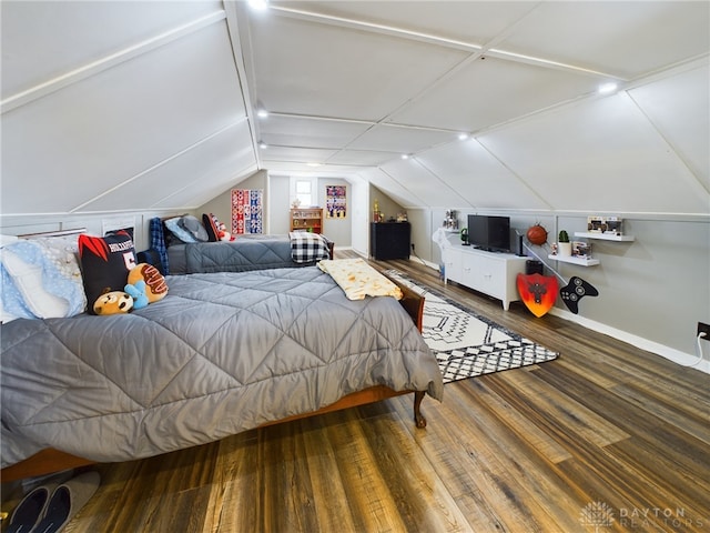 bedroom featuring wood-type flooring and vaulted ceiling