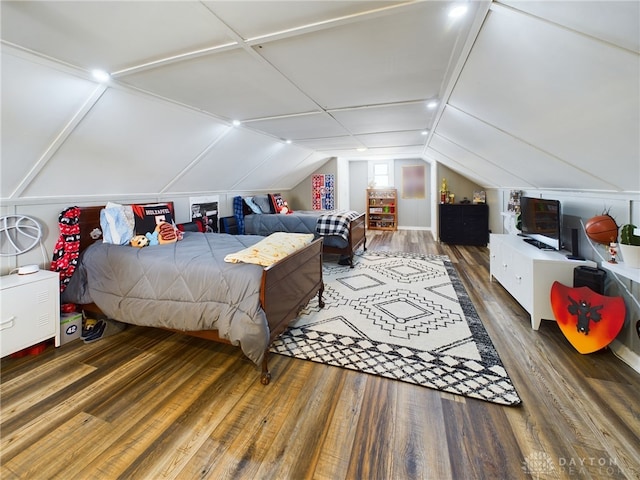 bedroom featuring lofted ceiling and dark wood-type flooring