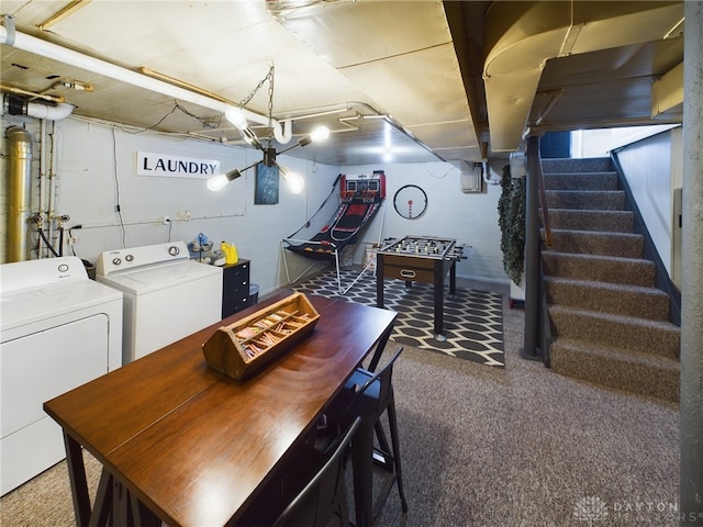 interior space featuring washing machine and clothes dryer and carpet