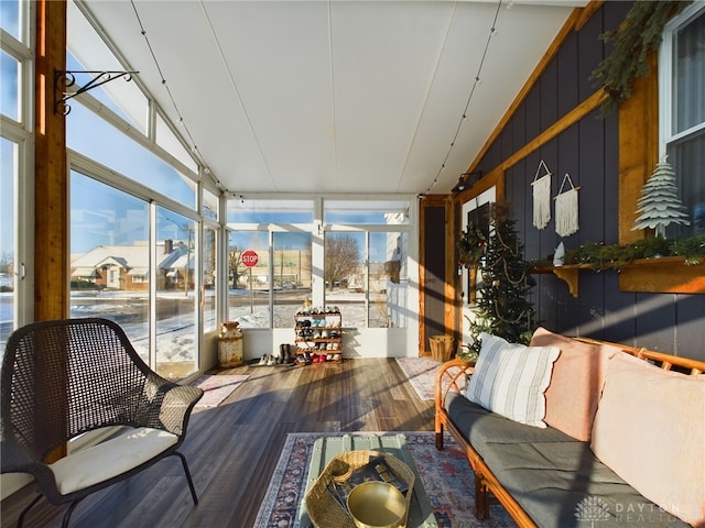 sunroom featuring lofted ceiling