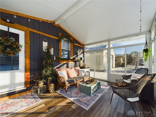 sunroom / solarium with lofted ceiling with beams