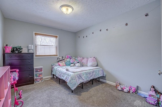 carpeted bedroom featuring a textured ceiling