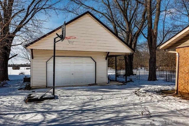 view of snow covered garage