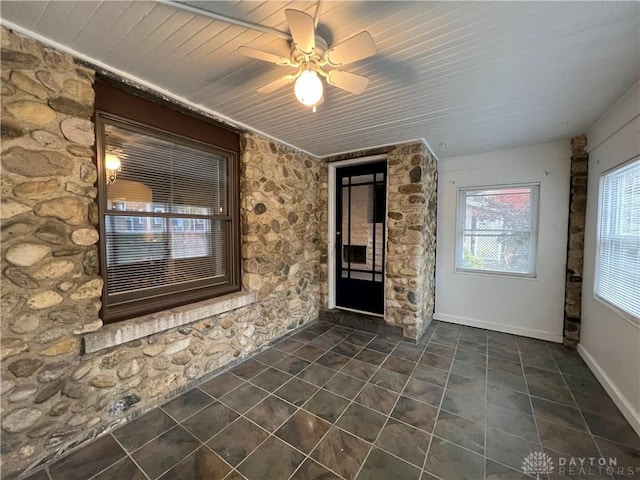 interior space featuring ceiling fan