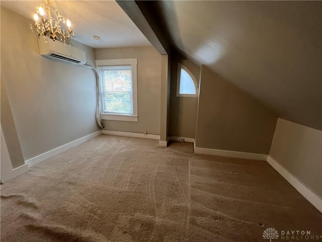 bonus room featuring an inviting chandelier, lofted ceiling, a wall mounted AC, and carpet