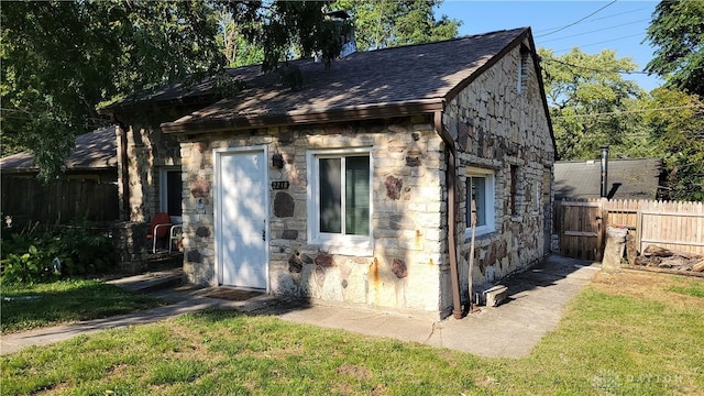 view of outbuilding featuring a yard