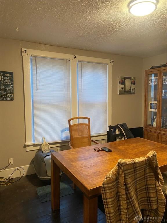 dining room with a textured ceiling