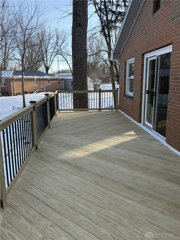 view of snow covered deck