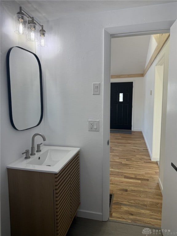 bathroom featuring vanity and hardwood / wood-style floors