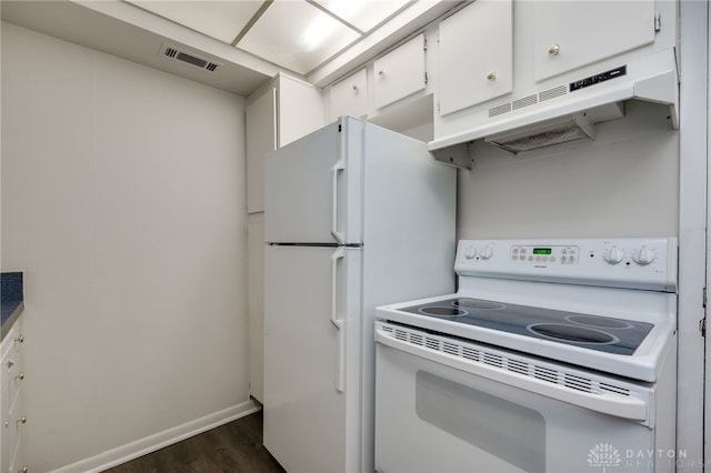 kitchen with dark hardwood / wood-style floors, white cabinets, and white appliances