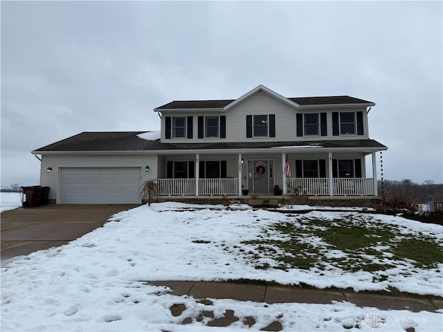 view of front of house with a porch and a garage