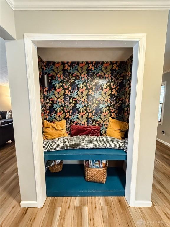 interior space with crown molding and hardwood / wood-style floors