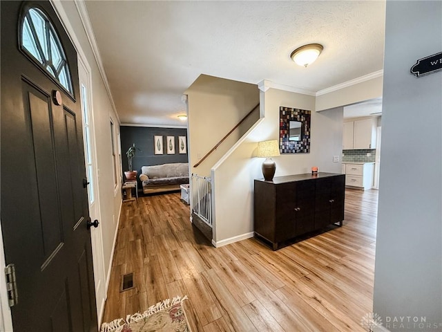 bedroom with ornamental molding and light wood-type flooring