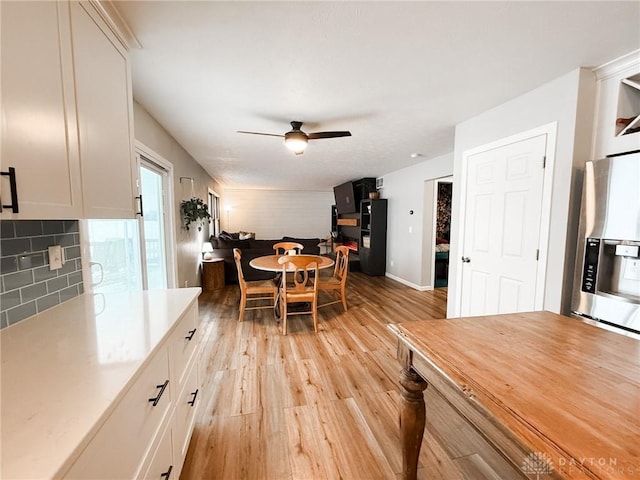 dining room featuring ceiling fan and light wood-type flooring