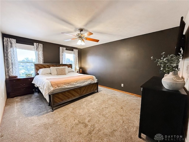 bedroom with ceiling fan and carpet flooring