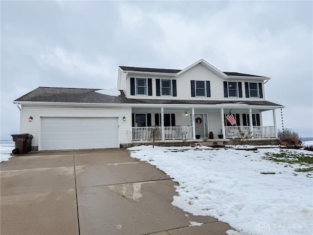 view of front of property with a garage and covered porch