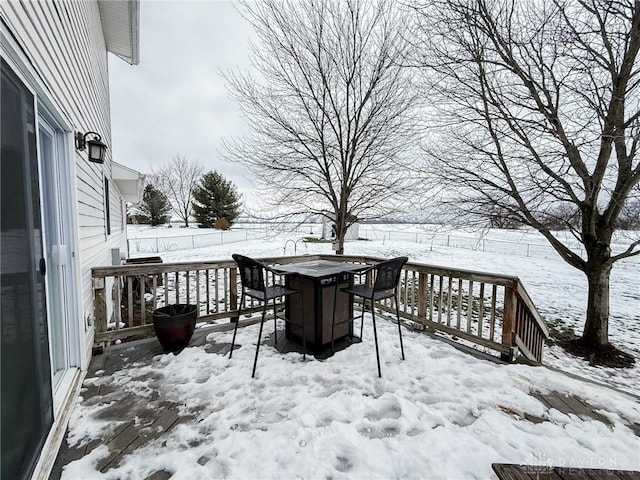 view of snow covered deck