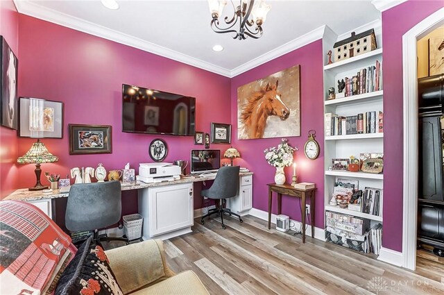 office space with ornamental molding, a chandelier, light hardwood / wood-style floors, and built in shelves