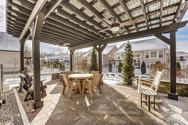 snow covered patio featuring ceiling fan