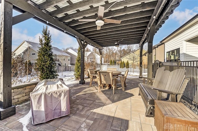 view of patio with area for grilling and ceiling fan