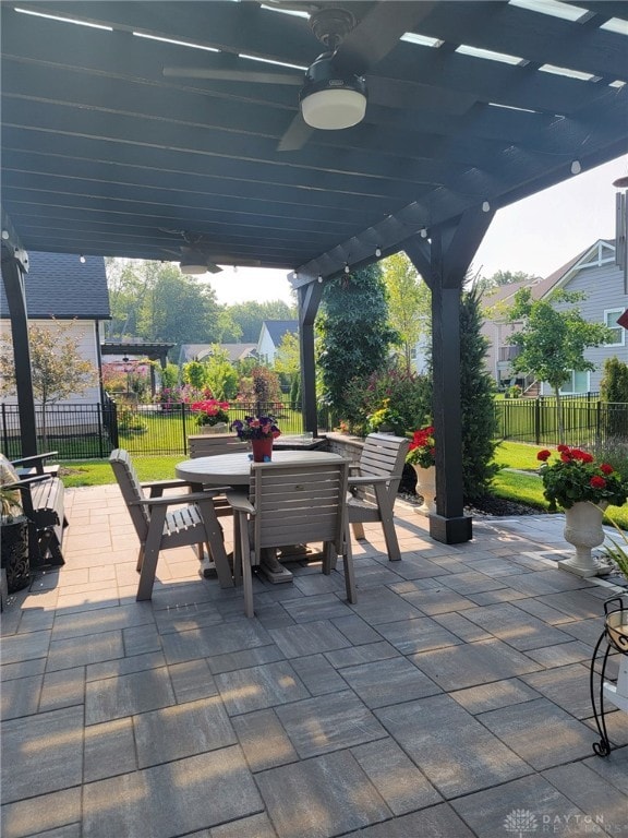 view of patio / terrace with ceiling fan and a pergola