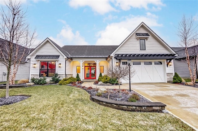 view of front of property with a front yard and french doors