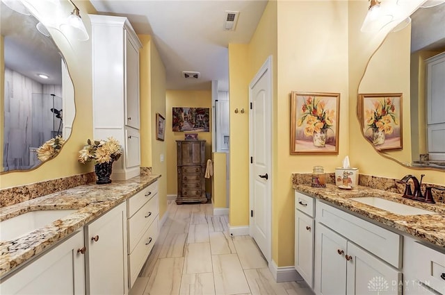 bathroom with walk in shower and vanity