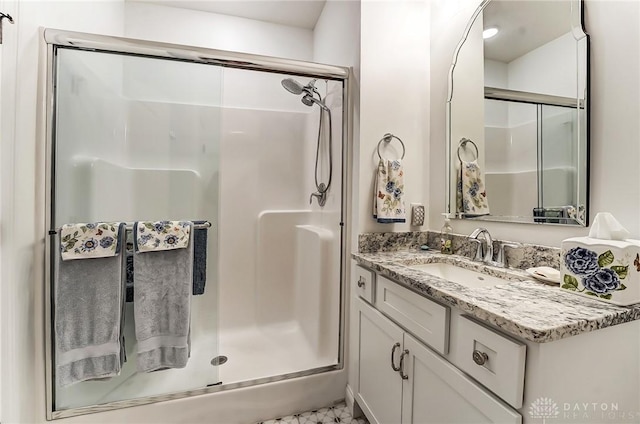 bathroom featuring vanity and walk in shower